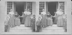 SA1523.2 - Members of the East Family are grouped on the steps and in a doorway of a building. Identified on the back., Winterthur Shaker Photograph and Post Card Collection 1851 to 1921c